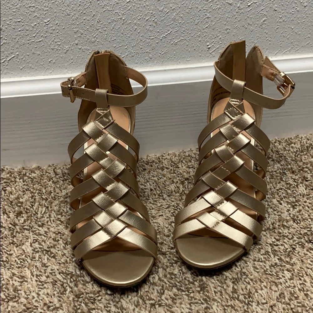 Gold chunky heel shoes.